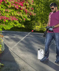 Man using Go-To Rechargeable Power Wand With 3 Way Spray Nozzle And 3.6V Lithium Ion Battery, Includes Charger, Universal 38mm Bottle Adapter