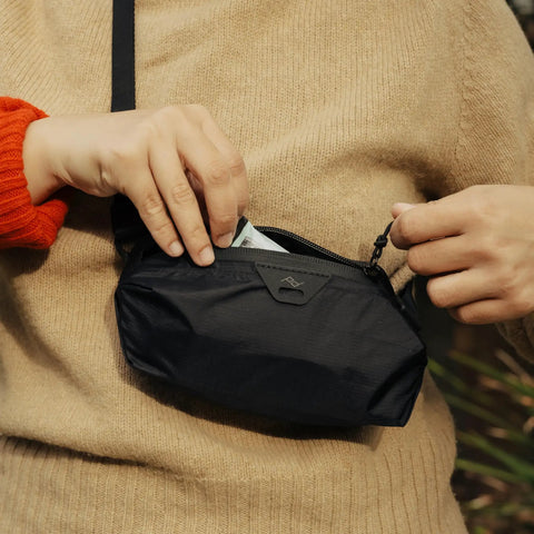 Person using Ultralight Terra Shell Packing Cube Weatherproof Luggage Organizer With Strap Attachment Points Size S