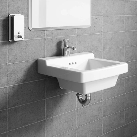 Pillar Tap Metering Faucet With Extended Spout 1.0 GPM Polished Chrome above a white ceramic sink, against tiled wall.
