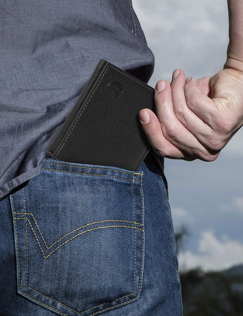 Person placing Genuine Leather RFID Blocking Trifold Wallet With Six Card Slots Clear ID Window Double Bill Fold And Strong RFID Protection in pocket.