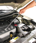 Amazon Slim 25-inch telescoping magnetic grabber with pocket clip used to retrieve metal items from a car engine bay.