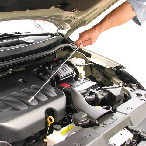 Amazon Slim 25-inch telescoping magnetic grabber with pocket clip used to retrieve metal items from a car engine bay.