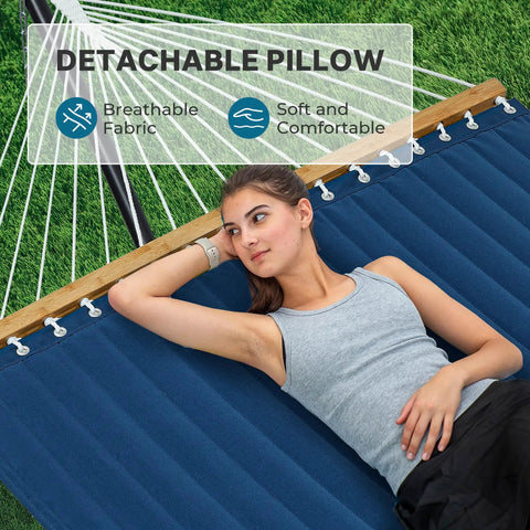 12Ft Two Person Quilted Outdoor Hammock With Stand Detachable Pillow And Bamboo Spreaders Navy Blue in use on lawn