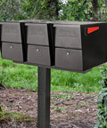 Three Mailbox Spreader Bar For One Post, Built Tough 12 Gauge Steel With Black Powder Coat, in outdoor garden setting.