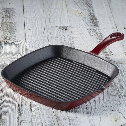 Chef's Classic Enameled Cast Iron Nine And A Quarter Inch Square Grill Pan in Cardinal Red on a rustic wooden surface