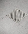 Hair Catcher Filter for Bathtub 9.4cm Steel Hair Catcher Filter(9.4cm) installed in modern bathroom flooring.