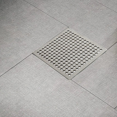 Hair Catcher Filter for Bathtub 9.4cm Steel Hair Catcher Filter(9.4cm) installed in modern bathroom flooring.