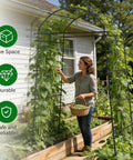 Person beside heavy duty garden arch trellis for climbing plants with adjustable width sturdy metal plant support in garden