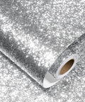 Close-up of rolled Silver Glitter Peel And Stick Wallpaper Self Adhesive Vinyl for Walls And Cabinets with a sequin finish.