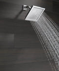 Single Spray Shower Head 6.5 Inch Square Chrome With High Pressure Powerful 2.5 GPM Water Flow For A Boss Level Full Body Raincan Shower RP62283 Durable Chrome Upgrade spraying water in bathroom setting.