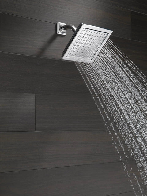 Single Spray Shower Head 6.5 Inch Square Chrome With High Pressure Powerful 2.5 GPM Water Flow For A Boss Level Full Body Raincan Shower RP62283 Durable Chrome Upgrade spraying water in bathroom setting.