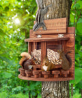 Crescent Wooden Squirrel Feeder Table for Outdoor Use on a tree, picnic table style seed tray with squirrels eating.