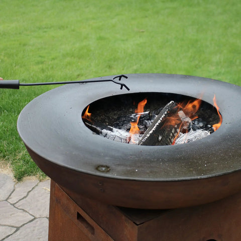 16 Inch Fire Pit Poker With Heat Resistant Resin Handle, Built Tough Campfire Tool For Indoor And Outdoor Use shown by a fire pit
