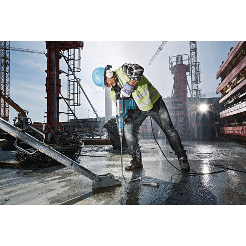 Worker using Speed-X SDS-Max Carbide Rotary Hammer Bit For Concrete Drilling 1-1/8 In X 21 In at construction site