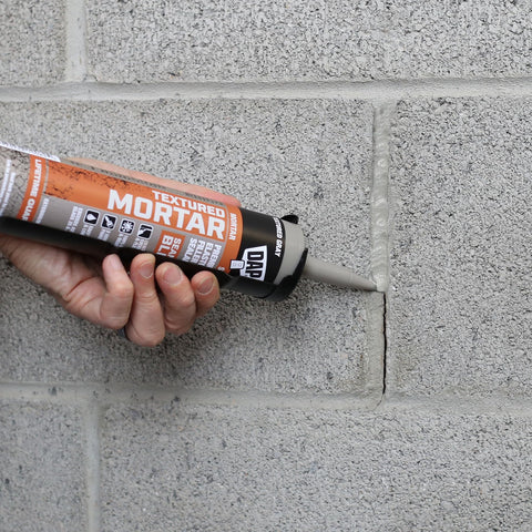 Applying Textured Mortar Filler And Sealant For Exterior And Interior Concrete to a wall crack, elastomeric latex in use, 10.1 oz