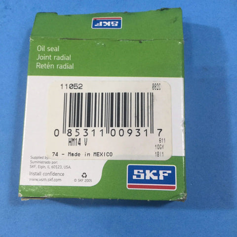 Oil seal box with green SKF packaging, barcode; text reads Oil seal, Joint radial, size 1-1/8x1-3/8x1/8 in