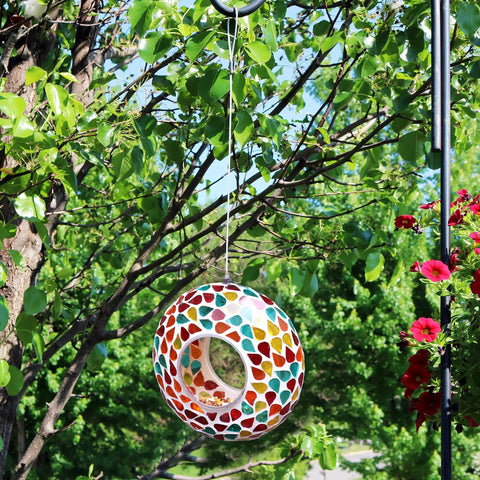 6 Inch Glass Mosaic Hanging Bird Feeder For Outdoors With Fly Through Opening Confetti Mosaic against a tree backdrop