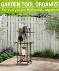 3-Tier Garden Tool Organizer On Wheels Heavy Duty Metal Rolling Storage Cart in a garden with rakes and shovels.