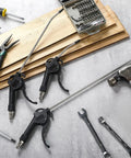 Heavy Duty 6 Piece Air Blow Gun Kit With Pistol Grip Handles Multi Size Assortment on a workbench with tools.