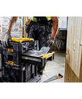 Worker using Sturdy T Stak III Deep Drawer Tool Storage Box With Drawer Built Tough As Nails For Impact Drivers Yellow And Black Construction Case Nine Point Five Liter Deep Drawer Storage Heavy Duty Organizer For Extreme Conditions
