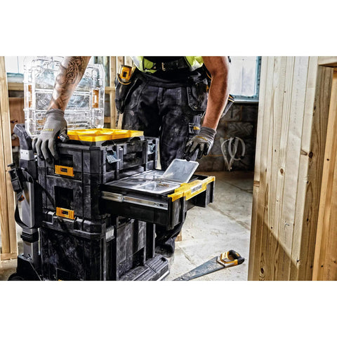 Worker using Sturdy T Stak III Deep Drawer Tool Storage Box With Drawer Built Tough As Nails For Impact Drivers Yellow And Black Construction Case Nine Point Five Liter Deep Drawer Storage Heavy Duty Organizer For Extreme Conditions