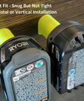 18V Cordless Tool And Battery Mounts Set 12 Pack shown with two battery brackets on wooden surface for garage organization.