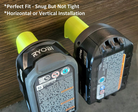 18V Cordless Tool And Battery Mounts Set 12 Pack shown with two battery brackets on wooden surface for garage organization.