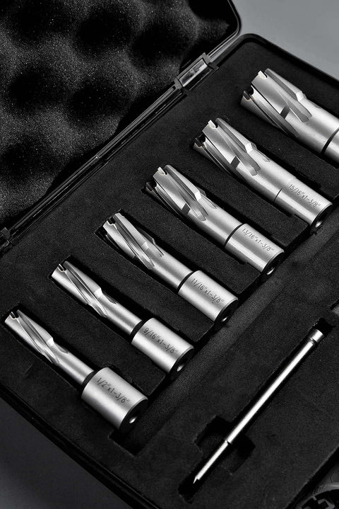 Eight carbide annular cutters with Weldon shanks in a foam-lined case; diameters 1/2"–1-1/16" and 1-3/8" cutting depth.