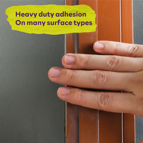 Hand applying Transparent Window Weather Sealing Tape 2 Inch By 30 Yards Clear Draft Blocking Sealing Film Tape No Residue