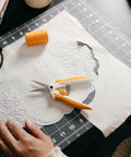 Micro Tip Spring Assisted Scissors For Precision Fabric Cutting With Stainless Steel Blades And Comfort Handle Ideal For Sewing Crafting And Detail Work on cutting mat