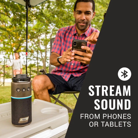 Man using OneSource Rechargeable Camping Gear Set With Camp Shower Cordless Vacuum Portable Fan Bluetooth Speaker And Air Pump Powered By A Single Battery System For All Day Power On The Go with speaker.