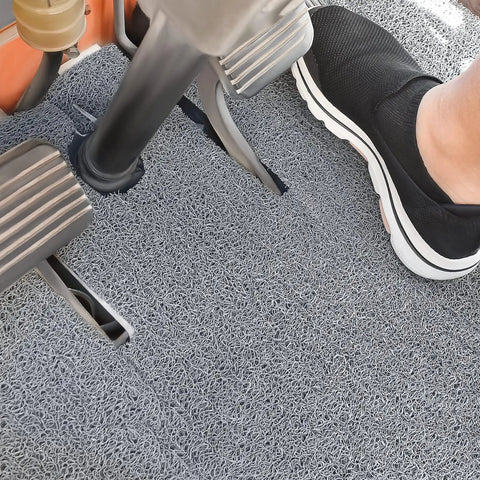 Heavy Duty Non Skid Forklift Floor Mat And Tractor Cab Protector With Tough As Nails Rubber Deck Pad Rock Solid Grip Trims Easy To Fit Any Machine Footwell For Smooth Daily Shop Grinds, detailed view of footwell with mat and pedals.