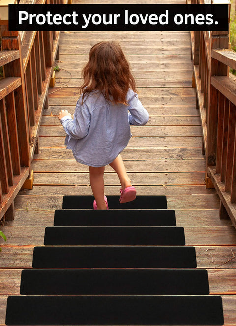 Young girl walking on steps with 6x40 Inch Stair Treads Non Slip Outdoor Tape 10 Pack Black Anti Slip Strips.