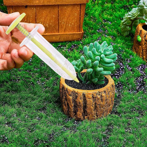 Handheld Seed Planter Tool For Seedlings With Ergonomic Dibber And Spreader, Durable ABS Construction, shown in use in garden