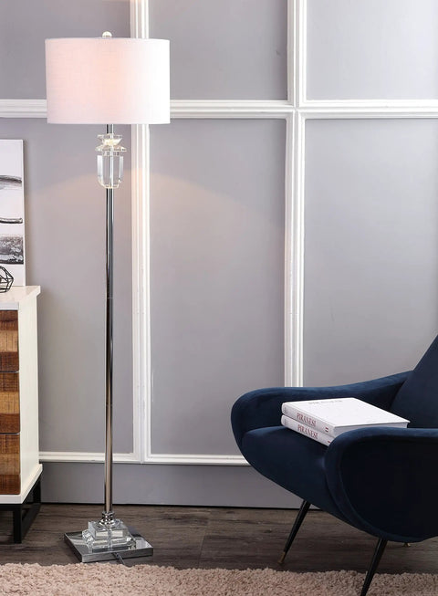 63 Inch Clear Chrome Faceted Crystal Iron LED Floor Lamp With White Linen Drum Shade in a living room next to a chair.