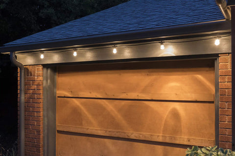 Backyard Bistro Style 24 Foot Outdoor String Lights With 12 Shatter Resistant Lifetime Bulbs, 2200K warm white on a garage