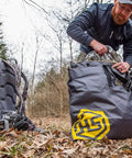 Man packing Scent Safe Deluxe Travel Scent Bag for hunting gear and clothing keeps your scent hidden and your gear scent free