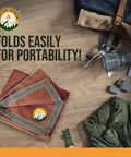 Under Grill Fire Pit Mat For Outdoor Deck And Grass Protection, Portable Ember Mat folded on wooden surface with camping gear