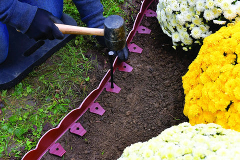 Installing scalloped top no dig landscape edging with extra anchoring spikes in red 100 foot kit flexible recycled plastic border
