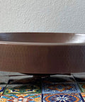 16 By 13 Inch Oval Skirted Vessel Copper Sink Hand Hammered Pure Copper Brown Finish For Modern Bath Semi Recessed Vessel One And A Half Inch Drain Opening Eighteen Gauge Handmade In Mexico CPS10 on decorative tiles
