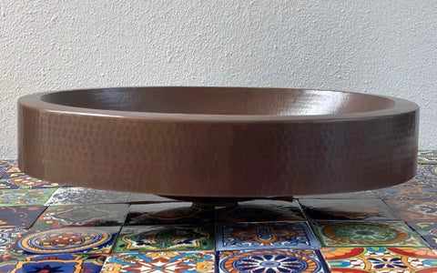 16 By 13 Inch Oval Skirted Vessel Copper Sink Hand Hammered Pure Copper Brown Finish For Modern Bath Semi Recessed Vessel One And A Half Inch Drain Opening Eighteen Gauge Handmade In Mexico CPS10 on decorative tiles
