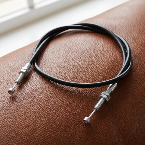 Heavy Duty Recliner Release Pull Replacement Cable, 39 Inch Length resting on brown leather surface