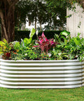 Galvanized Raised Garden Bed With 8x4x2 Ft Size, Outdoor Oval Metal Planter Box For Vegetables, Fruits, And Flowers, Durable Thickened Steel Construction, Weather Resistant Garden Bed In Silver, filled with plants.