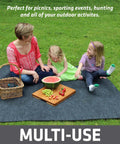 Family on Soft Plush Tent Carpet Mat With Waterproof Backing Keeps You Warm And Dry Inside The Tent, enjoying picnic in a park.