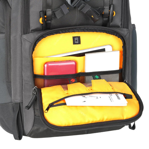 Alta Sky 62 Camera Backpack interior showing compartments for gear and accessories, black exterior with orange lining
