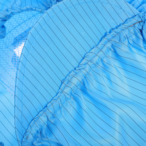 Close-up of lightweight blue anti static work caps designed with breathable mesh for cleanrooms and workshops.