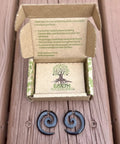 Spiral Fake Gauge Earrings Set In Black With Organic Wood And 316L Surgical Steel, displayed with eco-friendly packaging