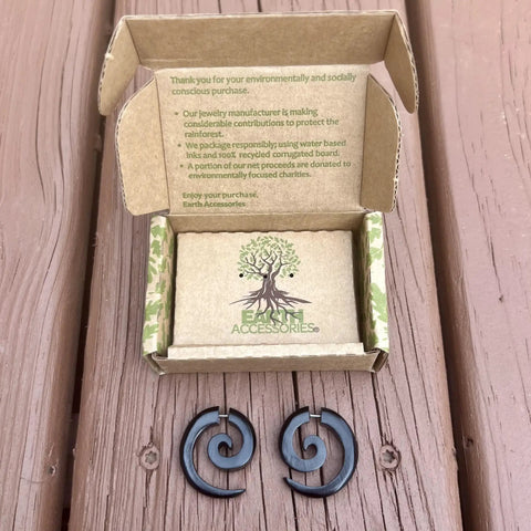 Spiral Fake Gauge Earrings Set In Black With Organic Wood And 316L Surgical Steel, displayed with eco-friendly packaging