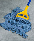 Beefy Heavy Duty Mop Head Replacement in blue cotton looped end strings attached to handle, shown on tile floor