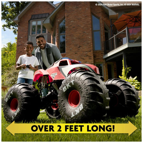 Father and child playing with Spider Man RC Monster Truck Mega Size Over Two Feet Long One Six Scale All Terrain Off Road Toy